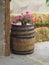 Old classic wooden barrel with flowers and hay - rural view