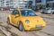 Old classic yellow Volkswagen New Beetle right side front view