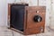 Old classical wooden photographic camera