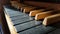 Old classy wooden musical instrument keyboard closeup, pipe organ manual, keys macro, dramatic high contrast lighting