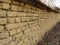 Old clay brickwork wall. Wall clay bricks and cracks suitable for rustic retro style background.