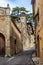 The old clock tower and the colorful narrow streets in the medieval town of Massa Marittima in Tuscany