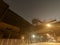 Old closed industrial ironworks at night. Epic metal structures and chimneys lit by the moon