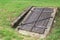 Old closed wooden entrance to an underground cellar