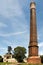 Old coal mine shaft with a mining tower in the foreground tall chimney