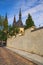 Old cobbles road the Church of Saint Peter and Paul. Summer landscape photo on a sunny morning. Vysehrad `Upper Castle