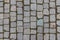 Old cobblestone tile texture in old town. City pavement background. Abstract granite stone brick pattern. Street sidewalk texture
