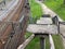 Old collapsed steps of a high railway bridge with holes. Broken dangerous bridge requiring urgent repair and closure