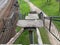 Old collapsed steps of a high railway bridge with holes. Broken dangerous bridge requiring urgent repair and closure