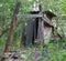 An old collapsed wooden building in a forest