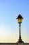 Old colonial style lamppost on the walls of the streets of Salvador