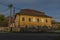 Old color building with blue sky in Besiny village in autumn evening