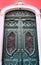 Old and colorful carved wood door with iron details
