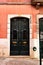 Old and colorful carved wood door with iron details