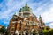 Old colorful Catholic temple against blue sky in Buenos Aires