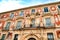 Old colorful Episcopal Palace facade in Murcia