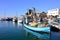 Old colorful fisherman boat tied to a pier in port of old jaffa