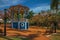 Old colorful gazebo and lighting pole in the middle of verdant garden, in a sunny day at SÃ£o Manuel.