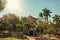 Old and colorful gazebo of square in the middle of verdant garden full of trees, in a bright sunny day at SÃ£o Manuel.