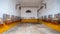 Old colorful horse stables interior, empty