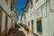 Old colorful houses in a deserted alley at Elvas