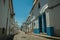 Old colorful houses with rough plaster and cobblestone causeway