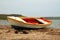 old colorful painted boat on a beach