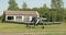 Old colorful plane with wings, propeller, wheels ready to fly standing on grass