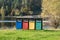 Old Colorful Recycle Bins In The Park. urns for separate collection of garbage.