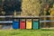 Old Colorful Recycle Bins In The Park. urns for separate collection of garbage.