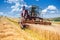 Old combine corn and wheat harvester. Agriculture industry