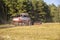 Old combine harvester harvests from the field