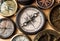 Old compass on wood desk.