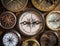 Old compass on wood desk.