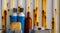 Old compressed liquid air bottles standing in front of a rusty container, Industrial background