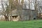 Old concrete bunker or fallout shelter among trees that was made to prepare Switzerland for war.