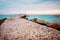 An old concrete sea bridge with rusty rails at the Black sea coast in Ravda, Bulgaria