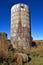 Old concrete stave silo and water tank