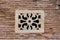 Old concrete wall decoration - flower pattern decorative detail used for a window