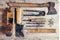 Old construction tools on a wooden workbench flat lay background. Carpenter table. Woodwork