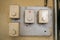 Old control panel on wall close-up. Vintage light round switches console. Without hand lettering. Don`t open.