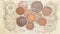 Old copper coins on banknotes