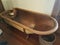 Old copper metal bathtub with wooden bucket