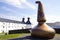 Old copper still at the entrance of the Ardbeg whisky distillery on the isle of Islay