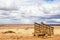 An old corral, abandoned in the desert of Arizona under a blue sky with bright white