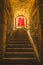 Old corridor with red curtain at the end. Concept for mystery, gothic, escape, hope