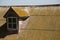 Old corrugated metal roof with moss and rust clear sky