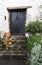 Old cottage door with pumpkins outside, Minehead, Somerset, UK