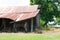 Old Country Barn, with a vintage Plow underneath