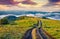 Old country road on Breska valley. Exciting summer view of Carpathian mountains, Ukraine, Europe.